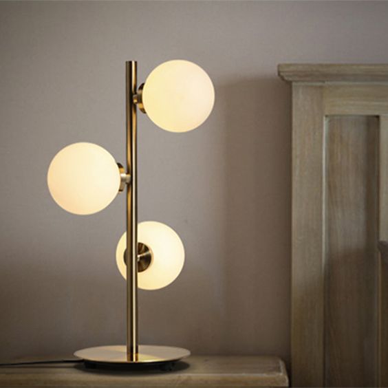 White & Brass Globe Deco Triple Arm